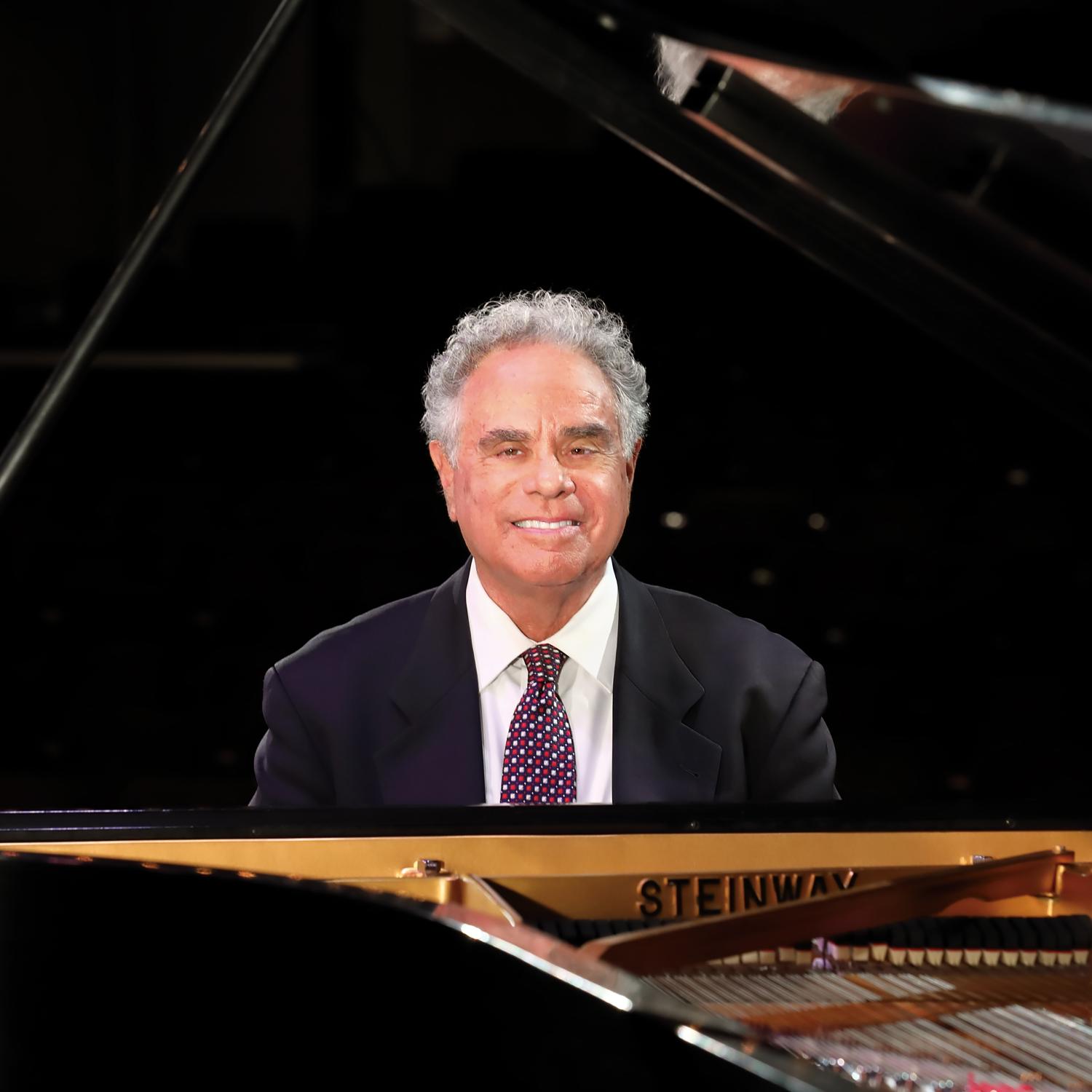 Jeffrey Siegel seated at the piano